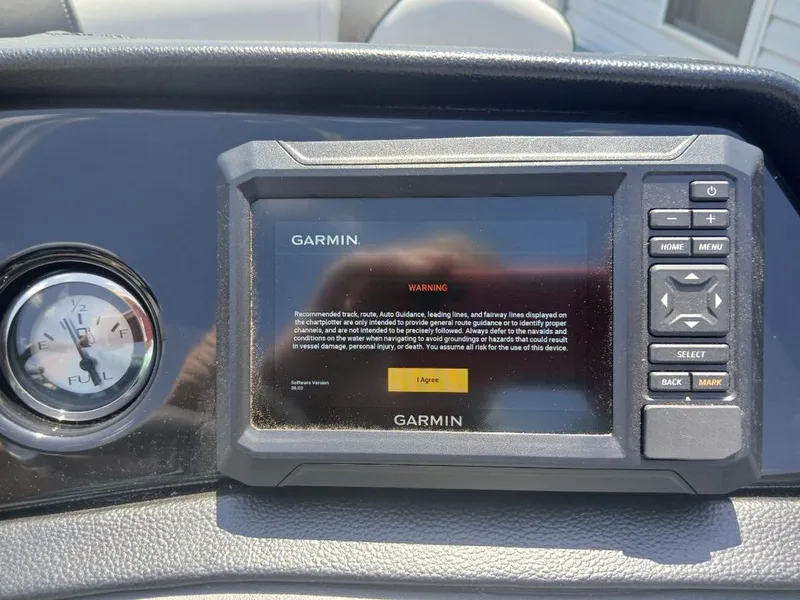 Slide: The Image of Garmin screen and fuel gauge on a boat. - 7