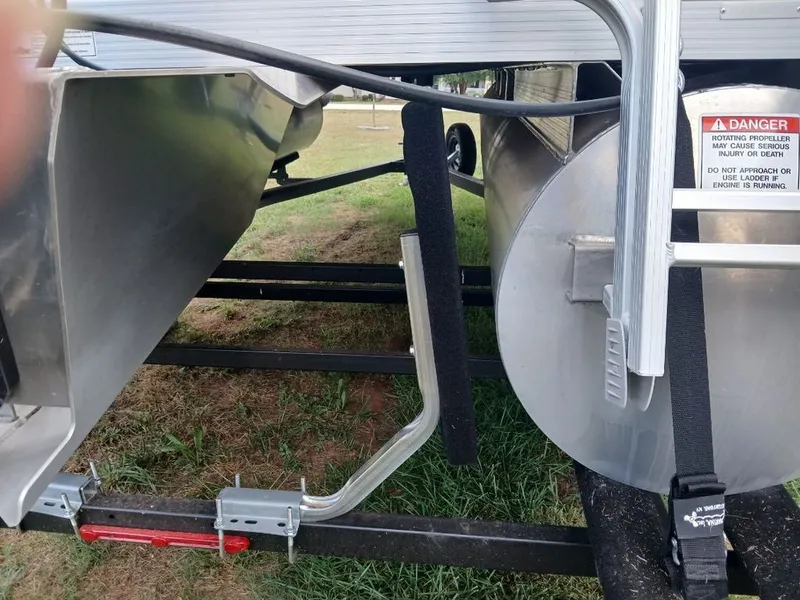 Slide: The Image of Close-up of the underside of a Bennington 20SL boat on a trailer. - 34