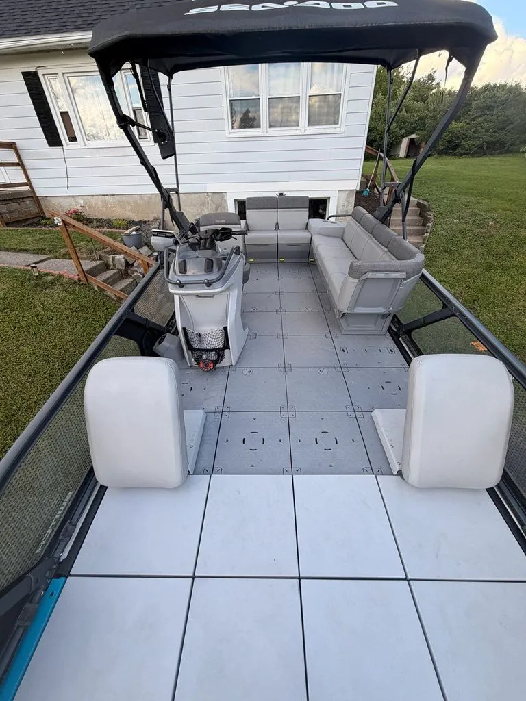 Slide: The Image of Sea-Doo Switch Sport 2023 with spacious deck and seating area. - 3
