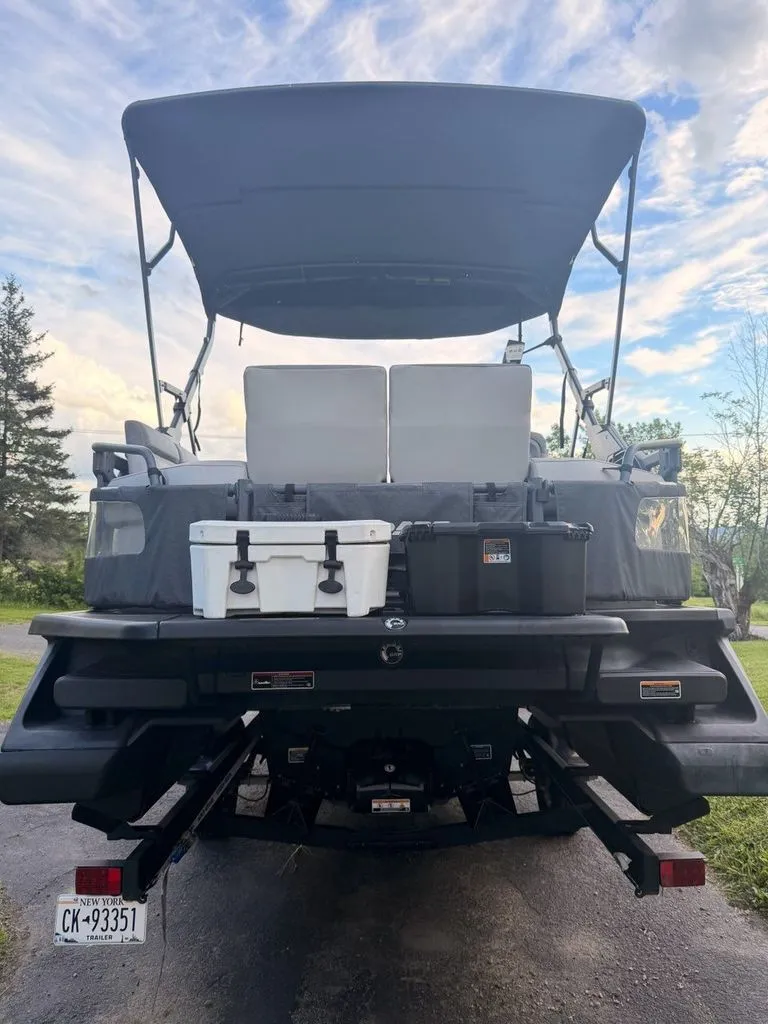 Slide: The Image of Rear view of a 2023 Sea-Doo Switch Sport with storage and seating. - 14
