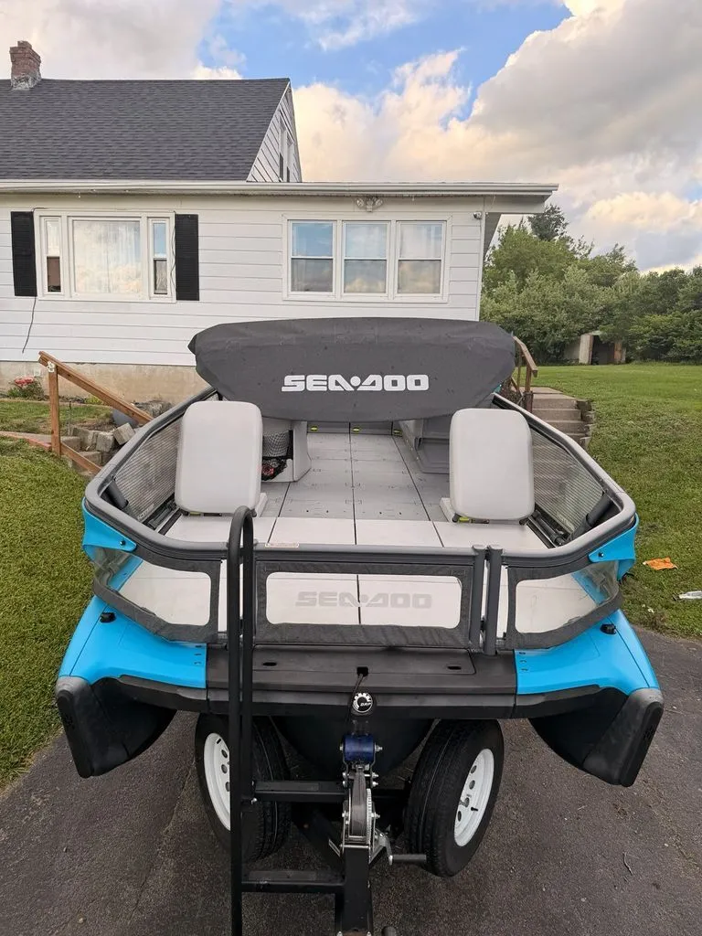 Slide: The Image of A 2023 Sea-Doo Switch Sport on a trailer in front of a house. - 11