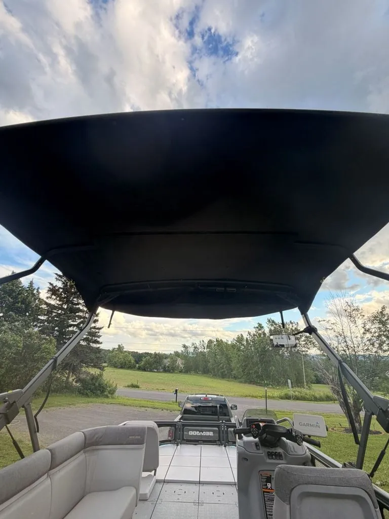 Slide: The Image of View from inside a Sea-Doo Switch Sport boat with canopy and helm console. - 12