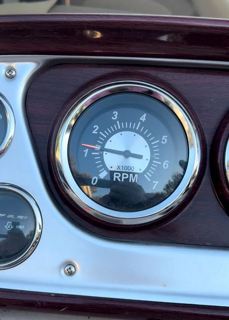 Slide: The Image of Close-up of a tachometer on a boat, displaying up to 7,000 RPM. - 8
