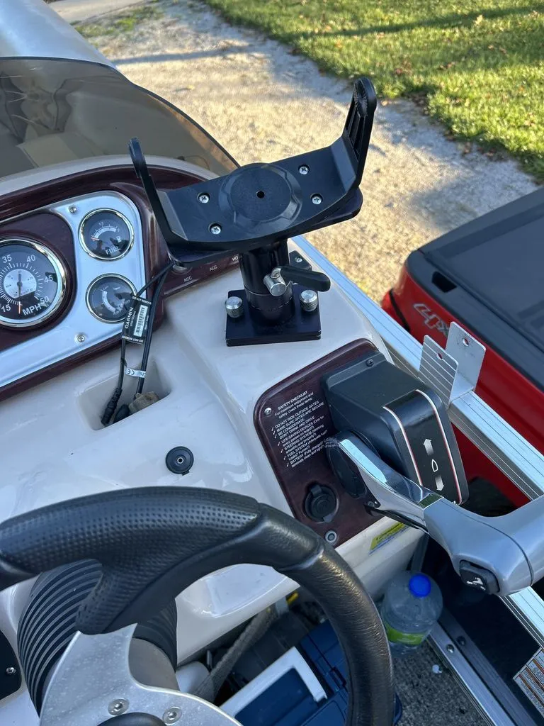 Slide: The Image of Helm of a 2011 Sylvan 8520 Cruise pontoon boat with steering wheel and instruments. - 7