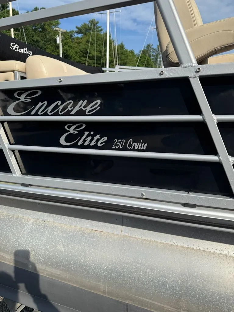 Slide: The Image of Close-up of a Bentley Pontoons Elite 25 with "Encore Elite 250 Cruise" lettering. - 11