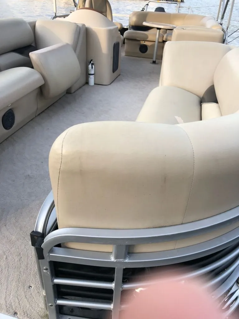 Slide: The Image of Interior of a 2014 Bentley Pontoons Elite 25 with beige seating. - 8