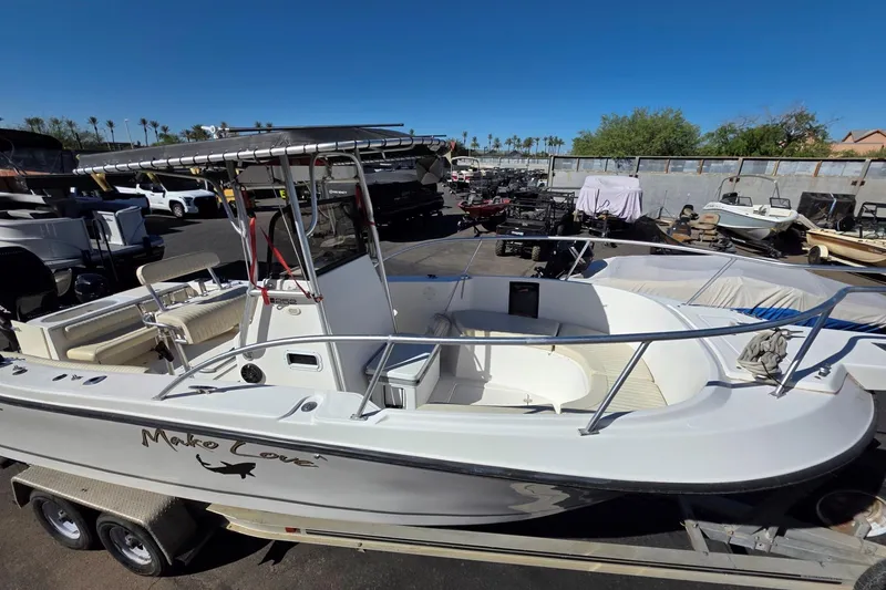 Slide: The Image of 2006 Mako 252 Center Console boat on trailer in outdoor storage area. - 5