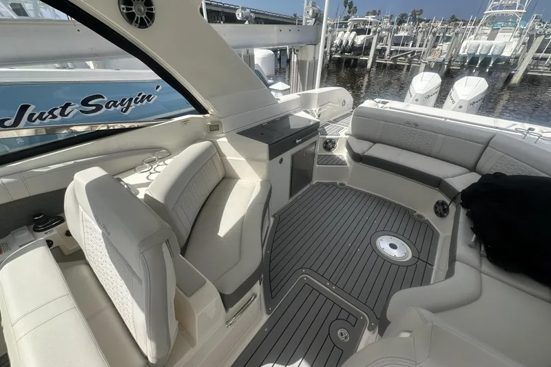 Slide: The Image of Luxurious 2020 Sea Ray SLX 350 Outboard boat interior with plush seating and sleek design. - 7