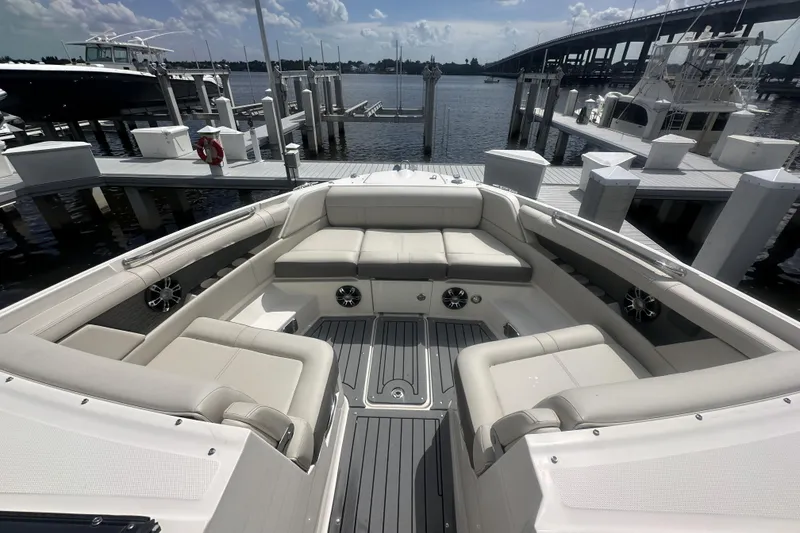 Slide: The Image of Luxurious 2020 Sea Ray SLX 350 Outboard boat interior at marina dock. - 6