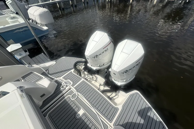 Slide: The Image of 2020 Sea Ray SLX 350 Outboard with twin engines docked at marina. - 3