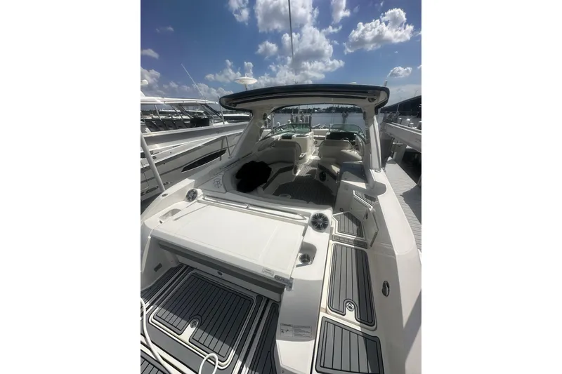Slide: The Image of 2020 Sea Ray SLX 350 Outboard boat interior under a sunny sky. - 5