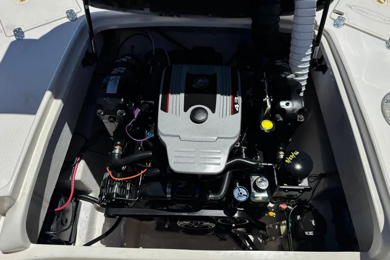 Slide: The Image of Engine compartment of a 2010 Tahoe 195 boat, featuring a MerCruiser 4.3L engine. - 18