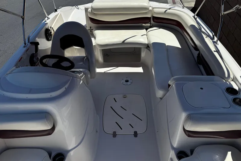Slide: The Image of Interior of a 2010 Tahoe 195 boat featuring seating and steering wheel. - 14