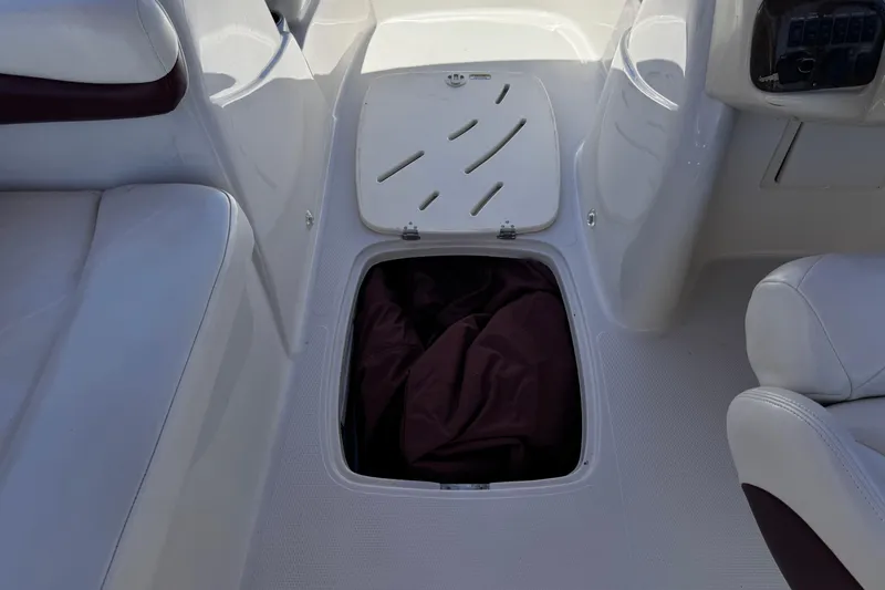 Slide: The Image of Open storage compartment on a 2010 Tahoe 195 boat interior. - 22