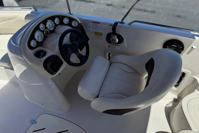 Slide: The Image of Cockpit of 2010 Tahoe 195 boat with steering wheel and gauges. - 23
