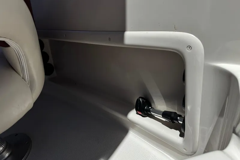 Slide: The Image of Interior view of a 2010 Tahoe 195 boat, featuring seating and storage compartment. - 21