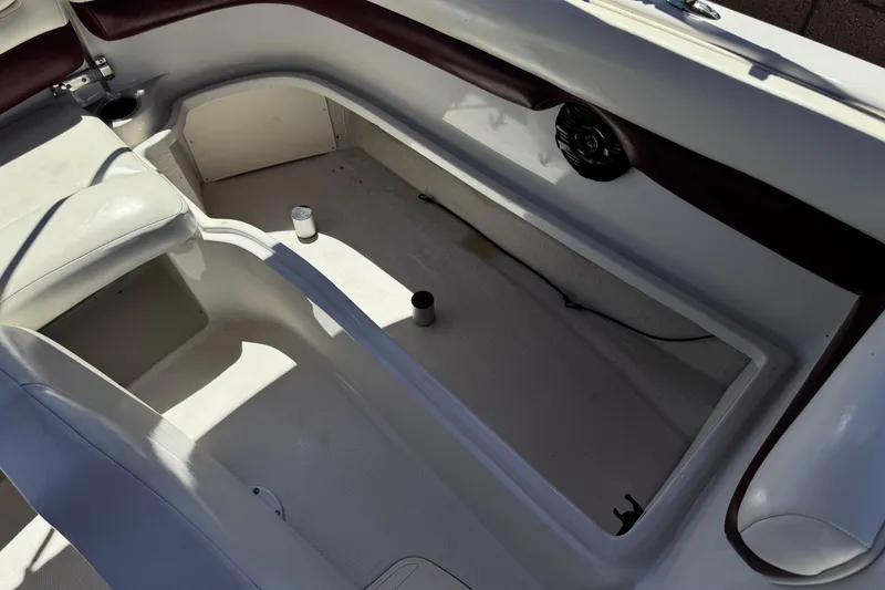 Slide: The Image of Interior of a 2010 Tahoe 195 boat showing seating and storage area. - 19