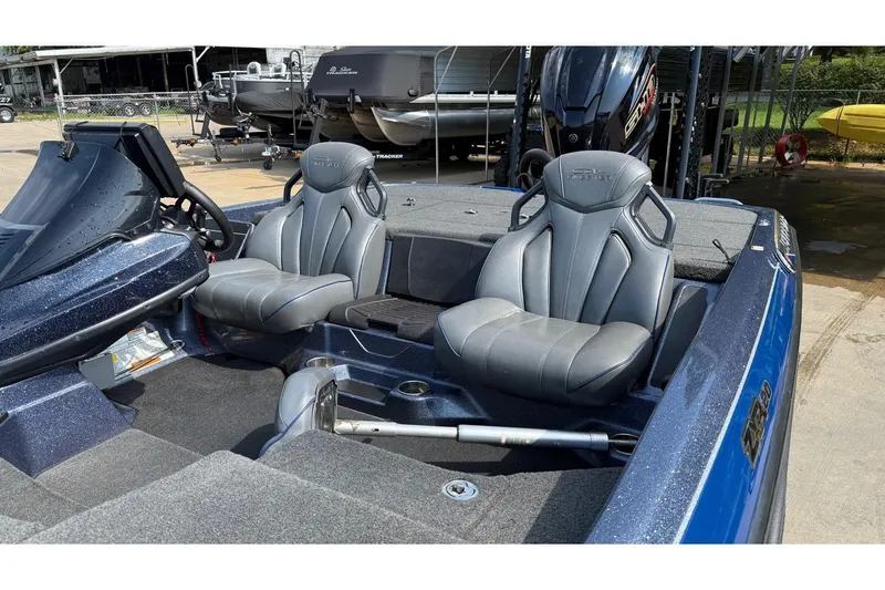 Slide: The Image of 2022 Skeeter ZXR20 SE boat interior with dual gray seats and steering console. - 3