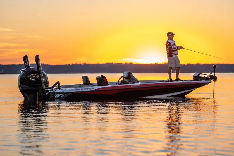 Slide: The Image of Manufacturer Provided Image: 2022 Skeeter ZXR 20 boat at sunset with a person fishing. - 6