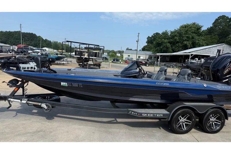 The Image of 2022 Skeeter ZXR20 SE bass boat on trailer, parked outdoors. - 0