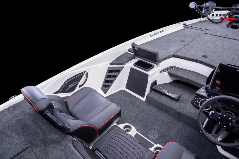 Slide: The Image of Manufacturer Provided Image: 2022 Skeeter ZXR 20 boat interior with black and red seats, steering wheel, and storage compartments. - 10