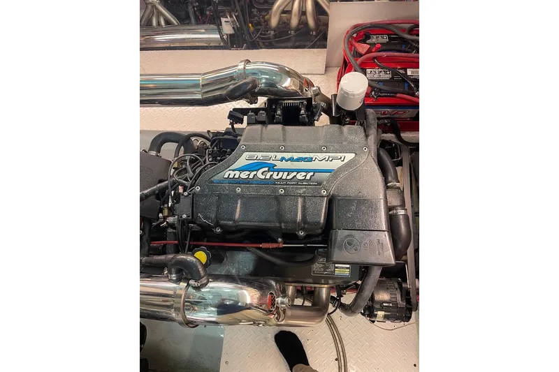 Slide: The Image of Engine of a 1990 Cary 50 boat, featuring a MerCruiser 8.2L MPI. - 7