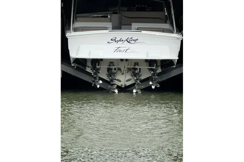 Slide: The Image of Rear view of a 1990 Cary 50 boat with multiple propellers in water. - 43