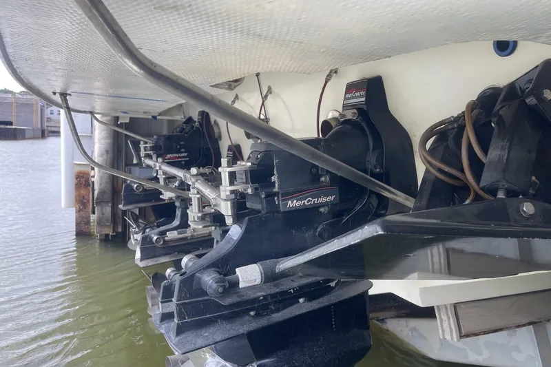 Slide: The Image of Stern view of a 1990 Cary 50 boat with MerCruiser engines. - 5