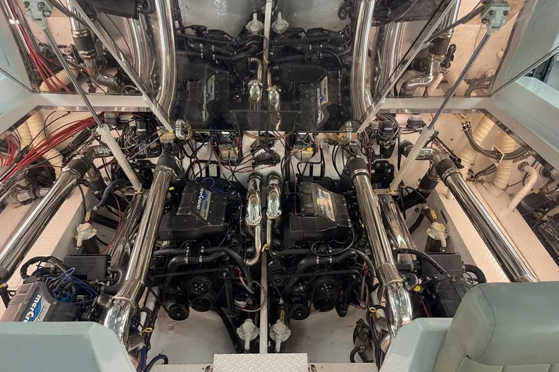Slide: The Image of Engine room of a 1990 Cary 50 boat with dual engines and polished components. - 6