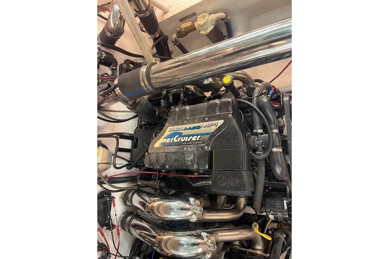 Slide: The Image of Engine of a 1990 Cary 50 boat featuring a MerCruiser 8.2L MPI motor. - 8