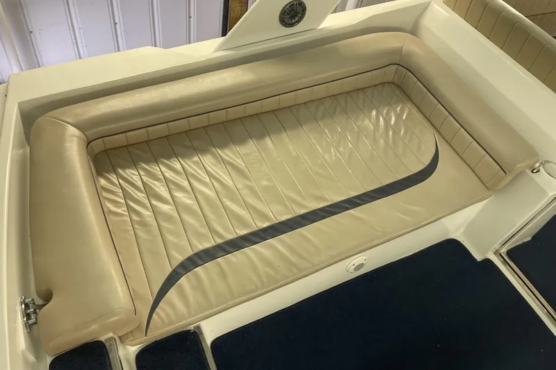 Slide: The Image of Cream leather seating on a 1990 Cary 50 boat, featuring sleek design and comfortable padding. - 14