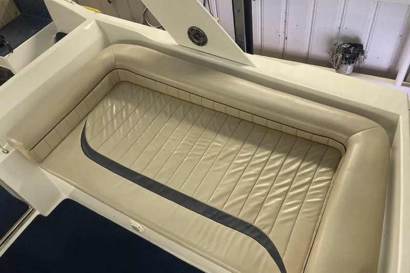 Slide: The Image of Cream leather seating on a 1990 Cary 50 boat, featuring a sleek design. - 13