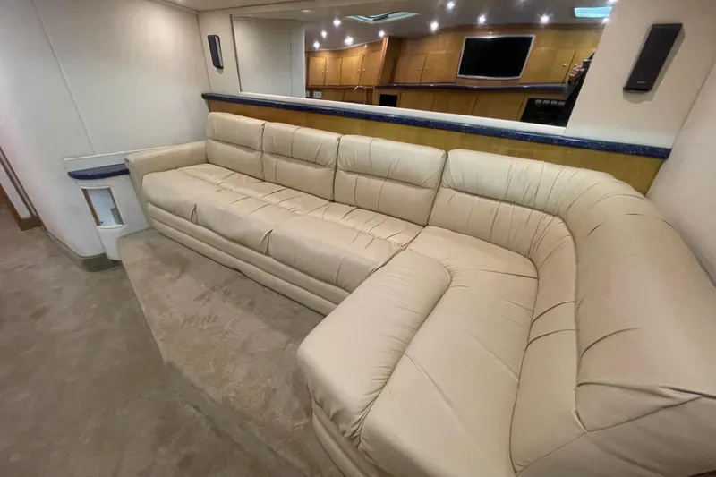 Slide: The Image of Luxurious beige leather sofa in a 1990 Cary 50 yacht interior. - 28