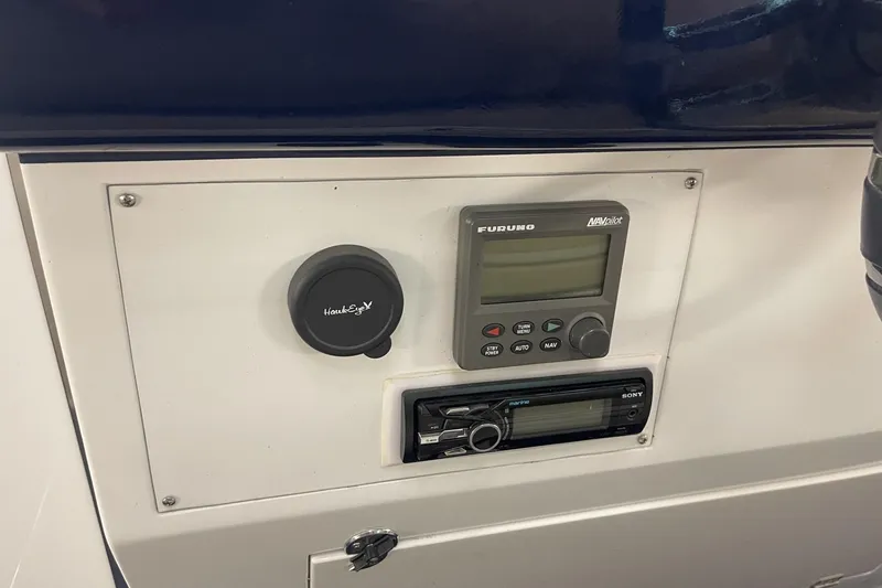 Slide: The Image of Control panel of a 1990 Cary 50 boat featuring Furuno and Sony devices. - 21