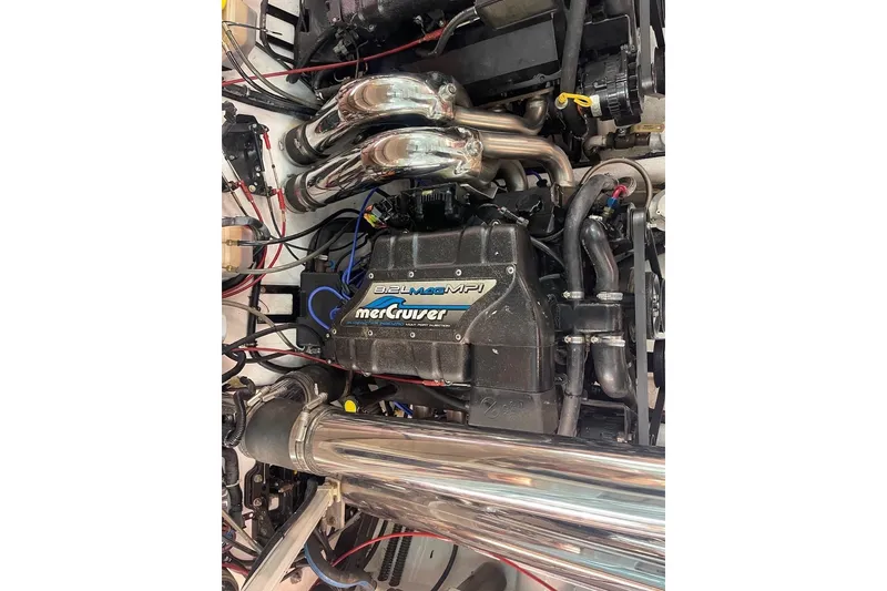 Slide: The Image of Engine of a 1990 Cary 50 boat, featuring a MerCruiser 8.2L MPI motor. - 9