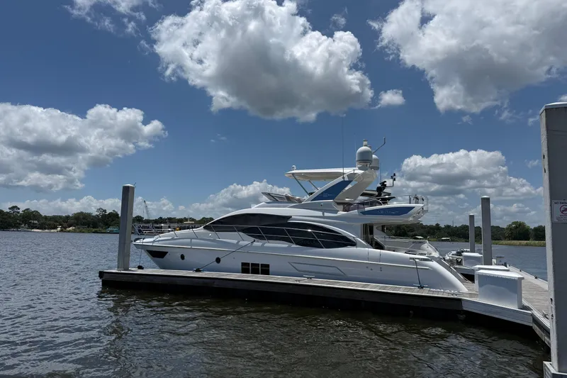Slide: The Image of Luxury 2014 Azimut 54 yacht docked under a partly cloudy sky. - 2