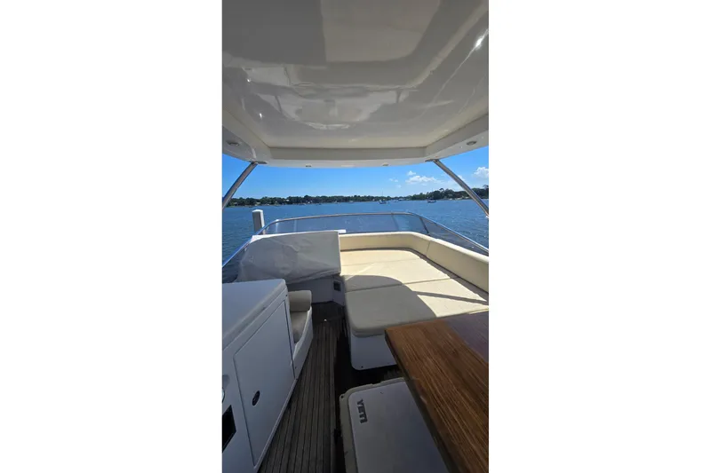 Slide: The Image of Luxurious 2014 Azimut 54 yacht interior with seating area and scenic water view. - 9