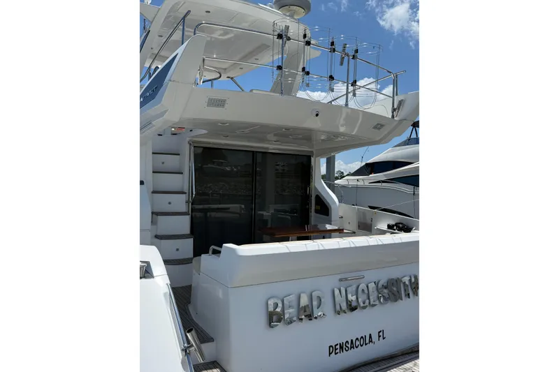Slide: The Image of 2014 Azimut 54 yacht docked in Pensacola, FL, featuring a sleek design and spacious deck. - 14