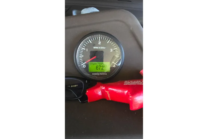 Slide: The Image of Volvo Penta engine gauge showing 672 hours on Azimut 54, 2014 model. - 7