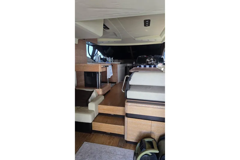 Slide: The Image of Luxurious interior of a 2014 Azimut 54 yacht, featuring modern design and comfortable seating. - 6