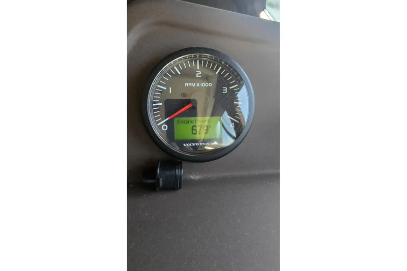 Slide: The Image of Tachometer displaying engine hours on 2014 Azimut 54 yacht dashboard. - 8