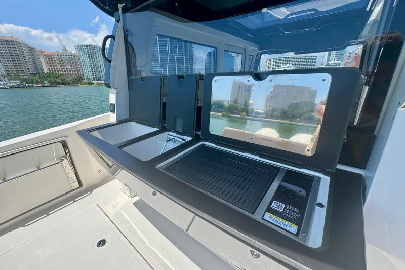 Slide: The Image of Outdoor kitchen setup on a 2026 Navan C30 boat, featuring a grill and sink. - 13