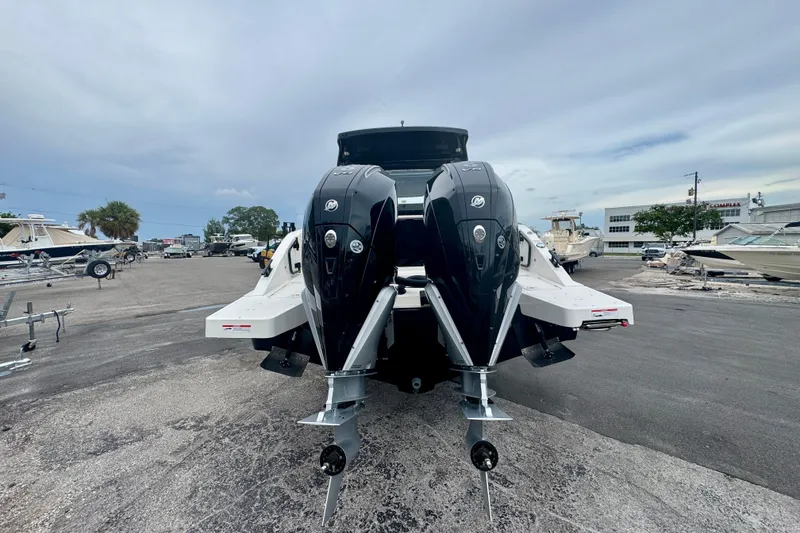 Slide: The Image of 2026 Navan C30 boat with dual outboard motors in a marina setting. - 5