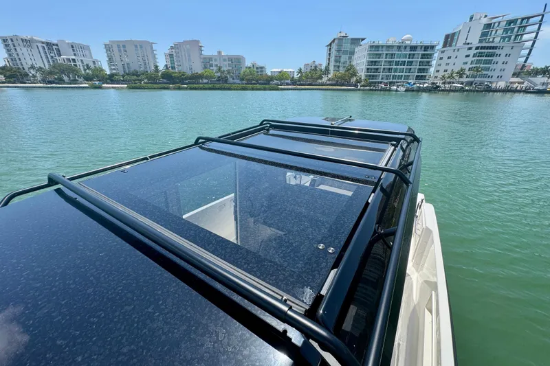 Slide: The Image of Navan C30 boat on water with cityscape background, 2026 model. - 52