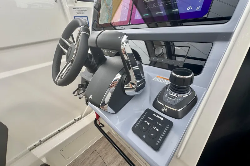 Slide: The Image of Helm of 2026 Navan C30 boat with advanced controls and navigation display. - 32