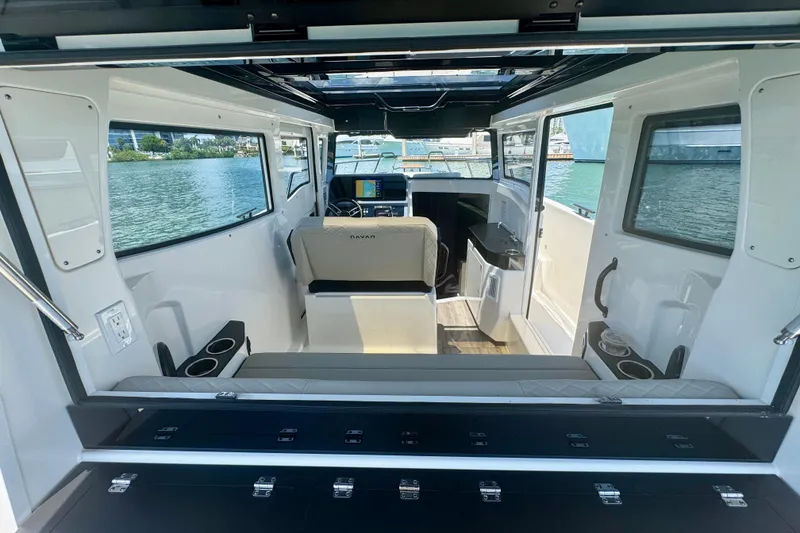 Slide: The Image of Interior view of 2026 Navan C30 boat, featuring modern seating and navigation equipment. - 22