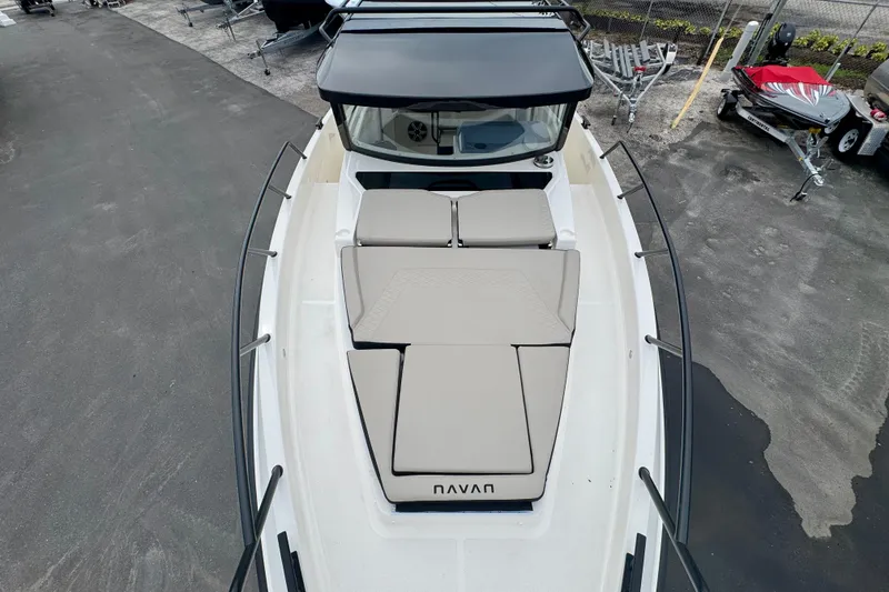 Slide: The Image of 2026 Navan C30 boat with cushioned deck, docked in a marina. - 49