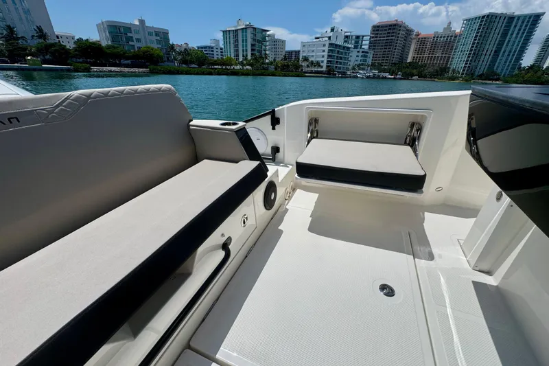 Slide: The Image of Luxurious seating on 2026 Navan C30 boat with cityscape backdrop. - 16