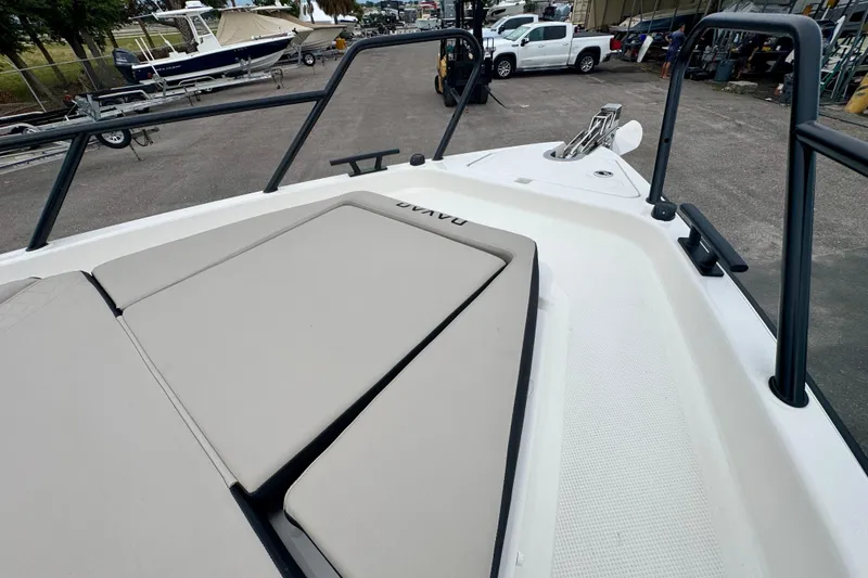 Slide: The Image of 2026 Navan C30 boat deck with cushioned seating and railing in a marina setting. - 48