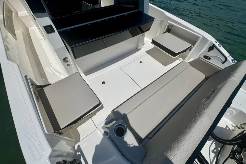 Slide: The Image of 2026 Navan C30 boat interior with sleek seating and modern design on the water. - 14